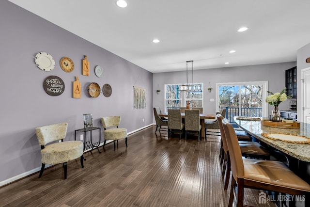 dining space with dark wood-type flooring, recessed lighting, and baseboards