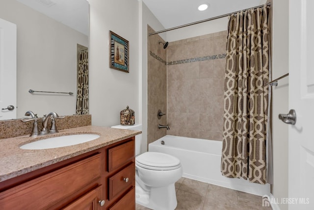 full bath featuring vanity, visible vents, shower / bath combo with shower curtain, tile patterned floors, and toilet