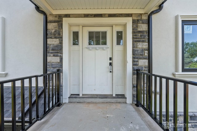 114 Whispering Hills Rd, South Plainfield, NJ 07080 - doorway to property with stone siding and stucco siding