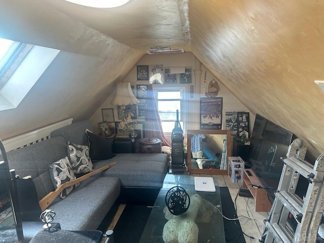 living area with lofted ceiling and visible vents