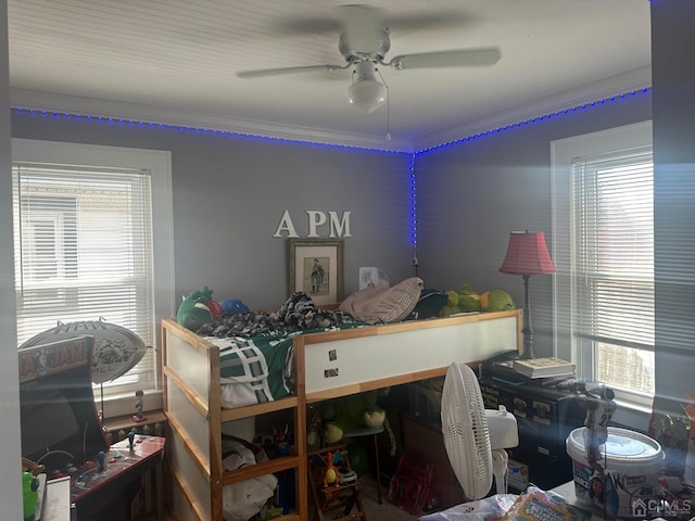 bedroom featuring a ceiling fan and crown molding