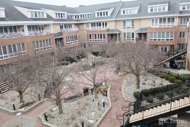 view of home's community featuring stairway