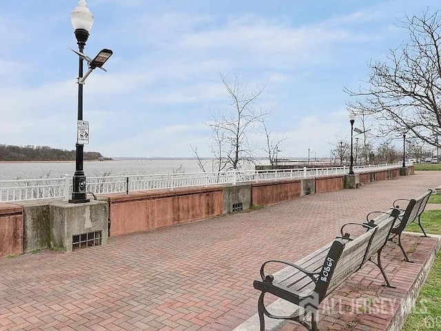 view of patio with a water view
