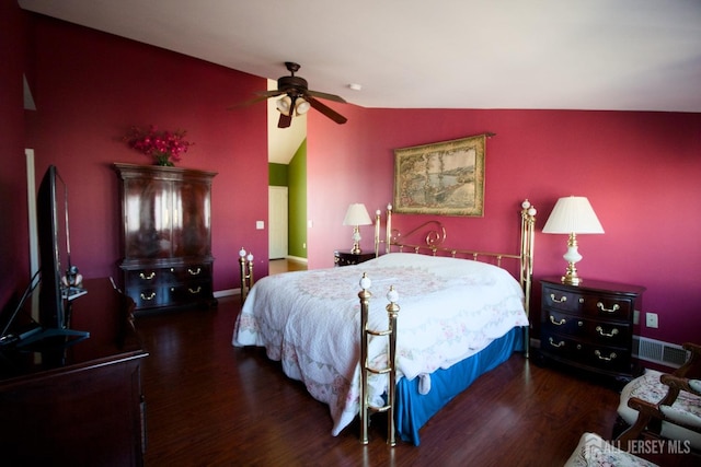 bedroom featuring a ceiling fan, vaulted ceiling, wood finished floors, and visible vents