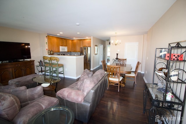 living area featuring recessed lighting, baseboards, dark wood-style floors, and a notable chandelier