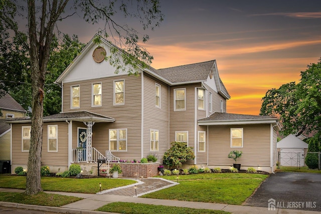 9 Sedgwick St, Jamesburg, NJ 08831 - view of front of house featuring a front yard and a shingled roof