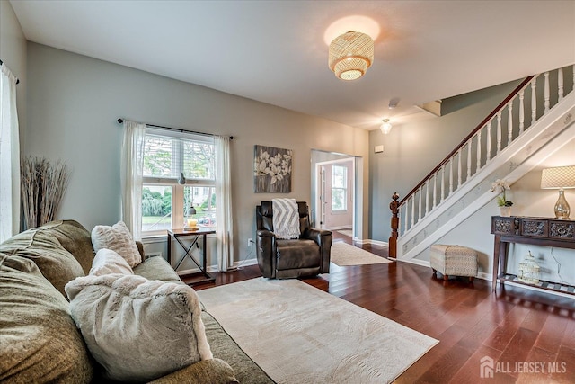 9 Sedgwick St, Jamesburg, NJ 08831 - living room featuring healthy amount of natural light, stairway, and wood finished floors