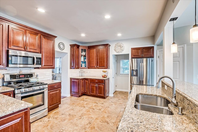 9 Sedgwick St, Jamesburg, NJ 08831 - kitchen with appliances with stainless steel finishes, decorative backsplash, light stone countertops, glass insert cabinets, and recessed lighting