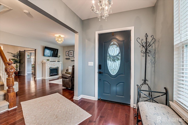9 Sedgwick St, Jamesburg, NJ 08831 - foyer featuring dark wood-type flooring, healthy amount of natural light, and a fireplace