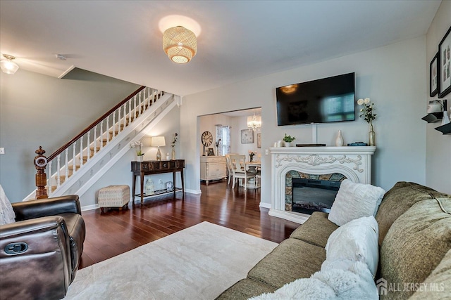 9 Sedgwick St, Jamesburg, NJ 08831 - living area with stairway, wood finished floors, and a fireplace