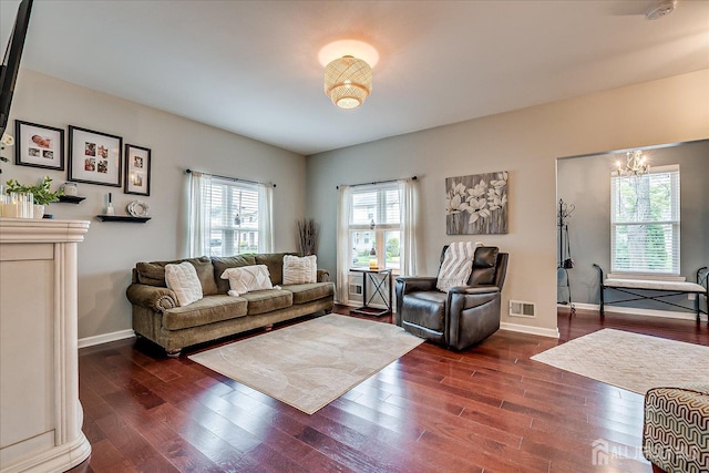 9 Sedgwick St, Jamesburg, NJ 08831 - living area featuring dark wood-style floors and a chandelier