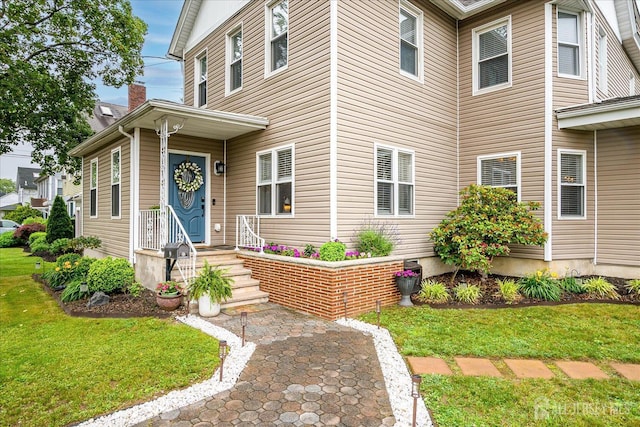 9 Sedgwick St, Jamesburg, NJ 08831 - view of front of property featuring a front yard and a chimney
