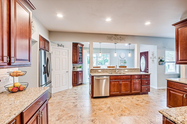 9 Sedgwick St, Jamesburg, NJ 08831 - kitchen with stainless steel appliances, tasteful backsplash, light stone countertops, pendant lighting, and recessed lighting