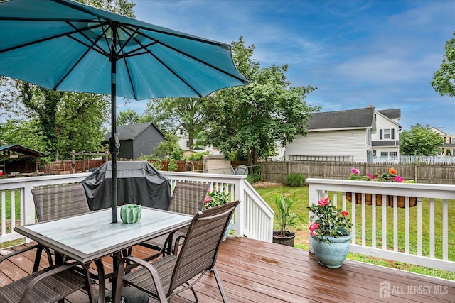 9 Sedgwick St, Jamesburg, NJ 08831 - wooden deck with a fenced backyard, area for grilling, and outdoor dining space