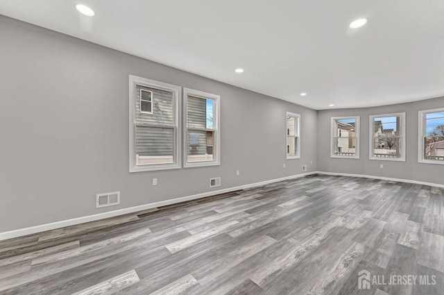 spare room with light wood-type flooring