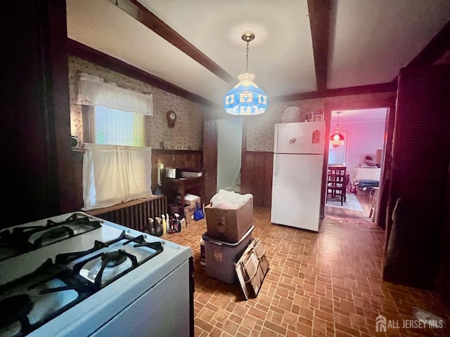 349 David St, South Amboy, NJ 08879 - kitchen featuring white appliances, wainscoting, wallpapered walls, brick patterned flooring, and pendant lighting