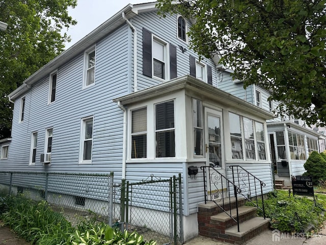 349 David St, South Amboy, NJ 08879 - view of property exterior with a sunroom