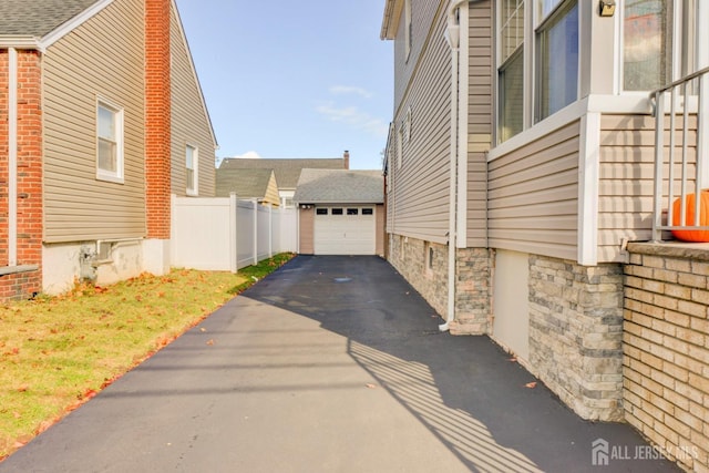 view of side of home with a garage