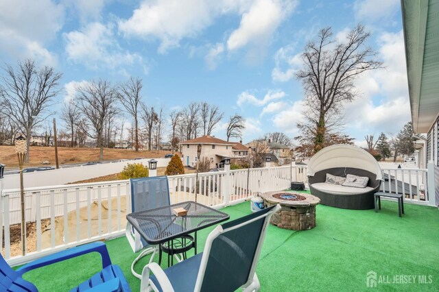 view of patio with an outdoor fire pit