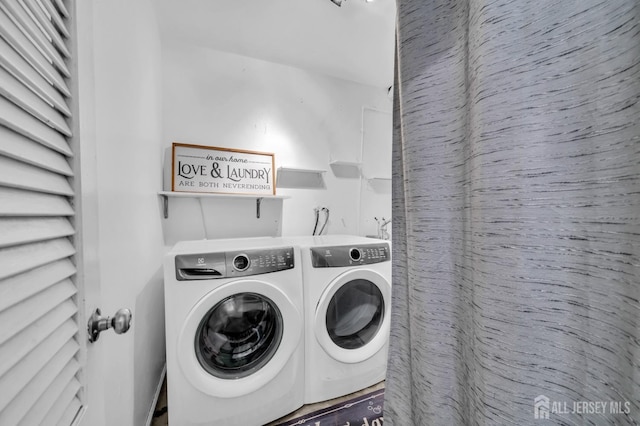 laundry room featuring washing machine and dryer