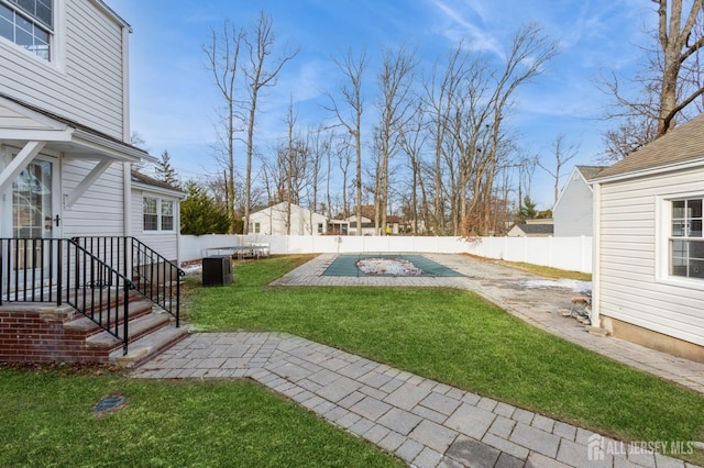 view of yard with a patio area and a covered pool