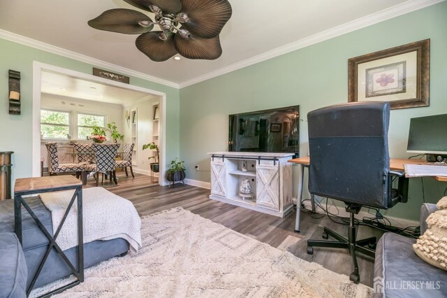 350 Church Ln, North Brunswick, NJ 08902 - bedroom with wood finished floors, crown molding, baseboards, an office area, and ceiling fan