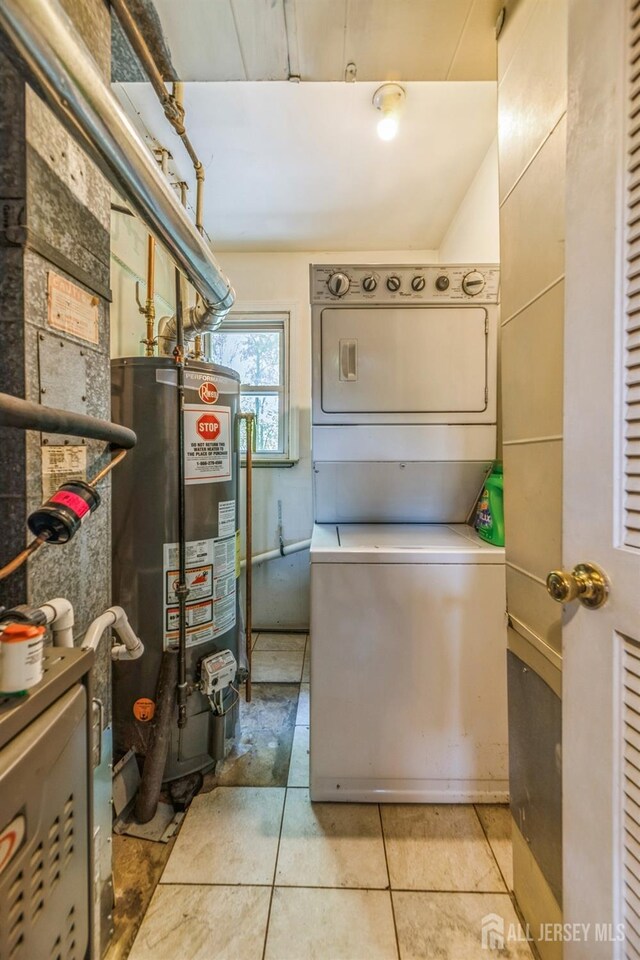 350 Church Ln, North Brunswick, NJ 08902 - kitchen with water heater, stacked washer / drying machine, and light tile patterned floors