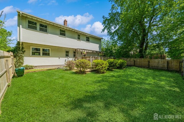 350 Church Ln, North Brunswick, NJ 08902 - rear view of property featuring a chimney