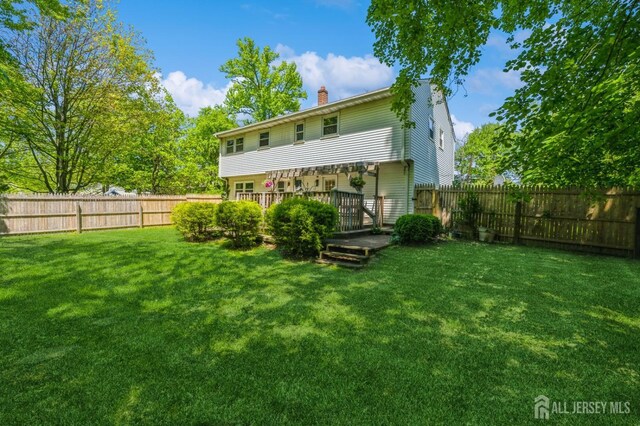 350 Church Ln, North Brunswick, NJ 08902 - rear view of property with a chimney and a deck