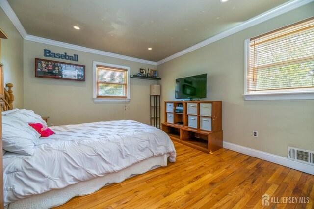 350 Church Ln, North Brunswick, NJ 08902 - bedroom featuring wood finished floors, crown molding, multiple windows, recessed lighting, and baseboards