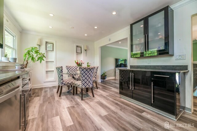 350 Church Ln, North Brunswick, NJ 08902 - dining space featuring ornamental molding, light wood-style floors, a dry bar, recessed lighting, and baseboards