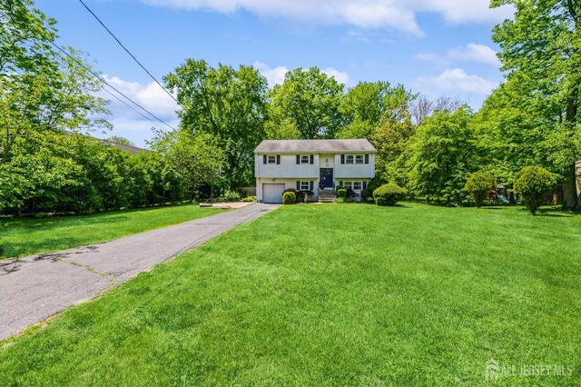 350 Church Ln, North Brunswick, NJ 08902 - raised ranch with driveway, an attached garage, and a front lawn