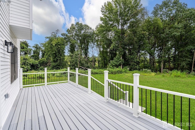 deck featuring a lawn