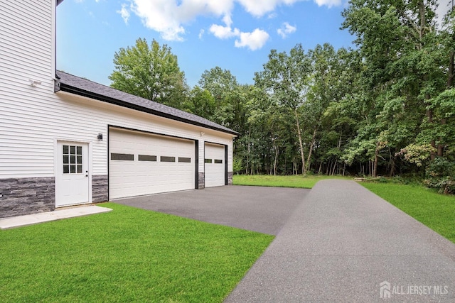 garage with a lawn