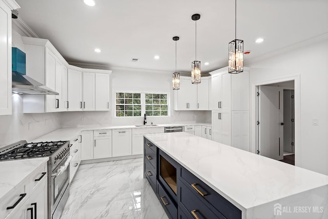 kitchen featuring white cabinetry, a center island, sink, pendant lighting, and stainless steel stove