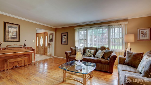 living area with light wood finished floors, crown molding, and baseboards