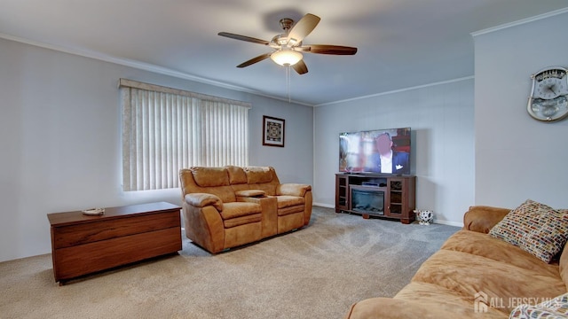 carpeted living room with ceiling fan and crown molding