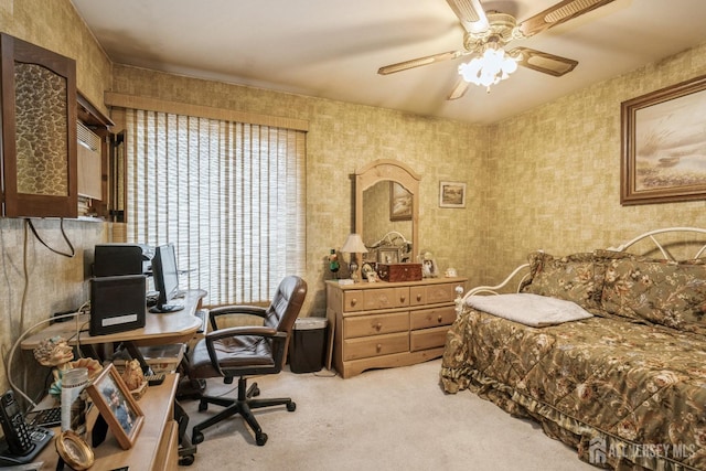 office space featuring light carpet, ceiling fan, and wallpapered walls