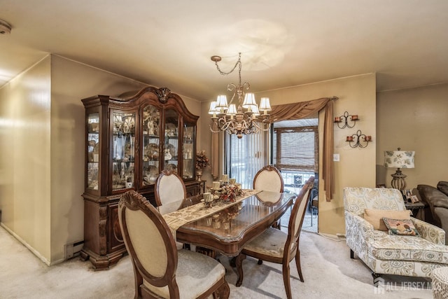 dining area with light carpet, a baseboard heating unit, baseboards, and a chandelier