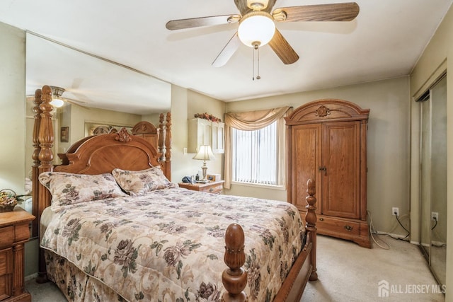 bedroom featuring a ceiling fan and light colored carpet