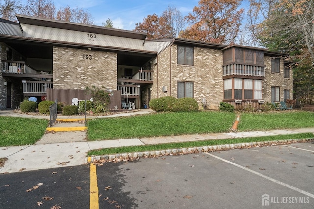view of property featuring uncovered parking
