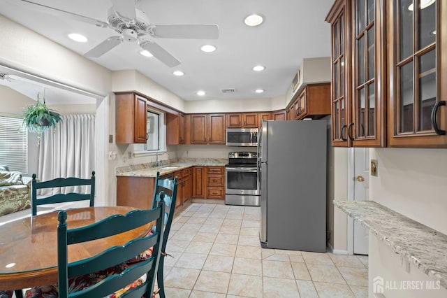 620 Deal Rd Unit 620A, Monroe, NJ 08831 - kitchen with appliances with stainless steel finishes, ceiling fan, light stone countertops, a sink, and brown cabinetry