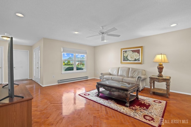 620 Deal Rd Unit 620A, Monroe, NJ 08831 - living area with a baseboard heating unit, a ceiling fan, a textured ceiling, baseboards, and recessed lighting