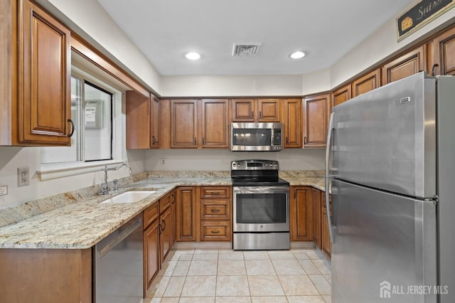 620 Deal Rd Unit 620A, Monroe, NJ 08831 - kitchen featuring stainless steel appliances, a sink, brown cabinets, and recessed lighting