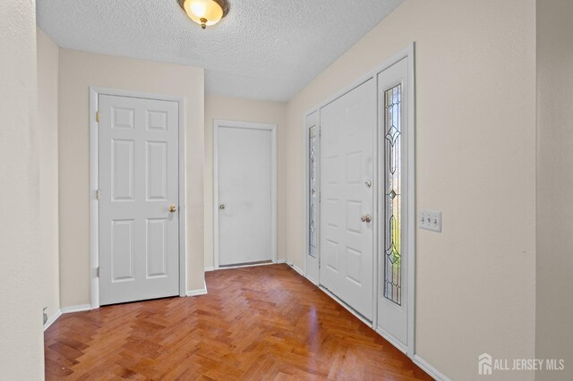 620 Deal Rd Unit 620A, Monroe, NJ 08831 - foyer entrance featuring a textured ceiling and baseboards