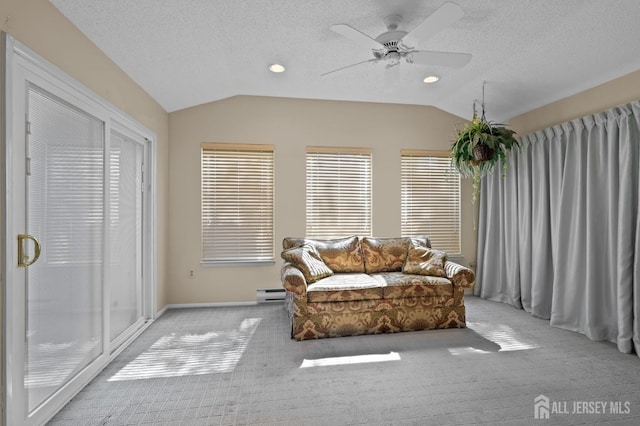620 Deal Rd Unit 620A, Monroe, NJ 08831 - living area with vaulted ceiling, light carpet, a ceiling fan, a textured ceiling, and a baseboard heating unit