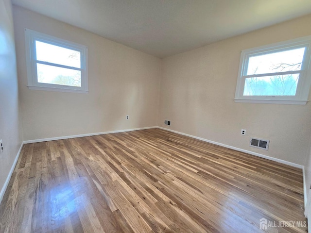 20 Ellingham Ave, Monroe, NJ 08831 - empty room with wood finished floors and baseboards