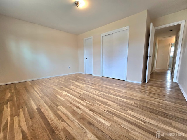 20 Ellingham Ave, Monroe, NJ 08831 - unfurnished bedroom with wood finished floors, baseboards, and a closet