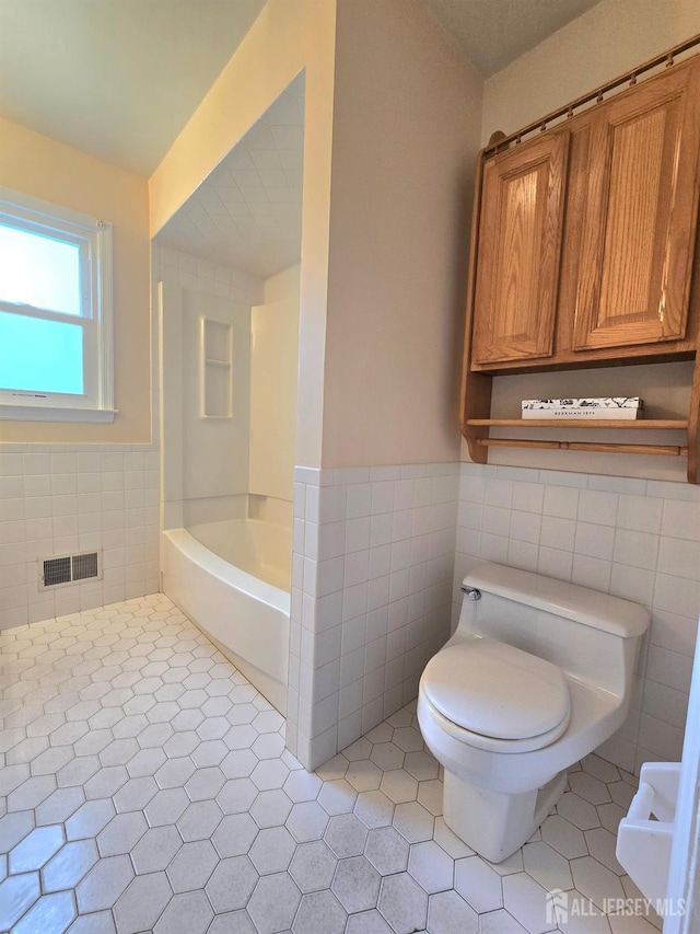 20 Ellingham Ave, Monroe, NJ 08831 - full bathroom with tile walls, toilet, tile patterned flooring, and a wainscoted wall