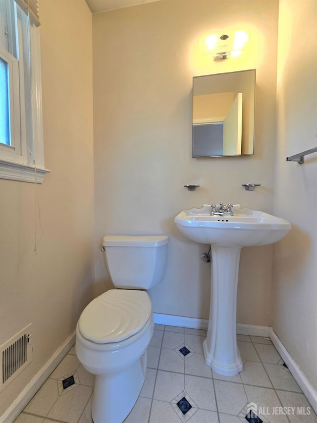 20 Ellingham Ave, Monroe, NJ 08831 - bathroom featuring toilet, tile patterned floors, and baseboards